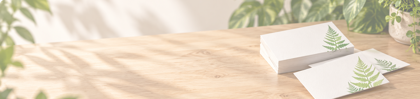 Whenua Printing stationery on a sunlit desk